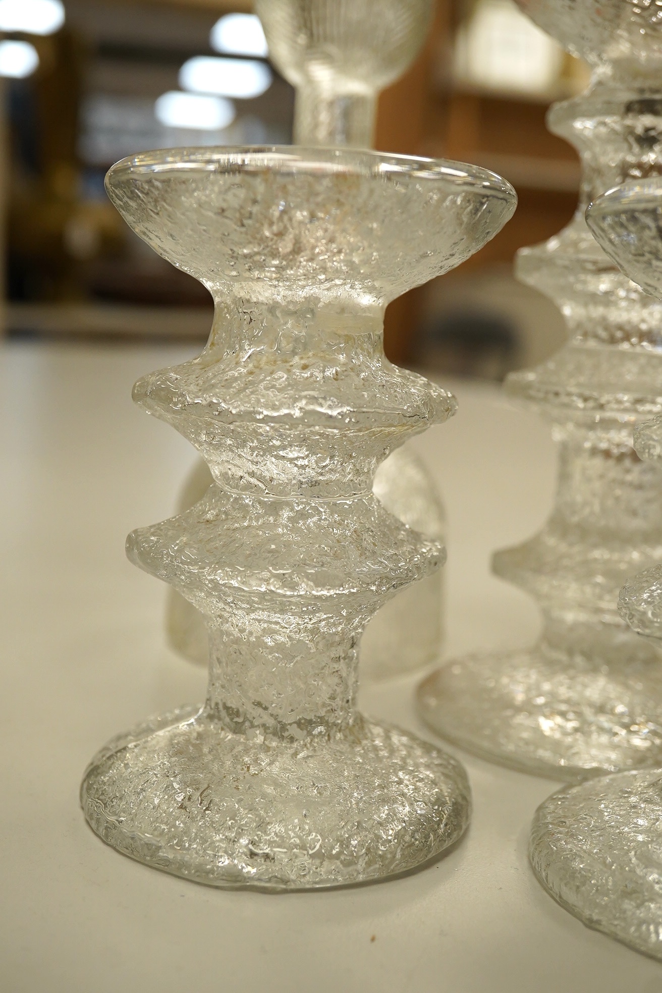 A group of Scandinavian clear glass candlesticks (7) including Timo Sarpaneva, tallest Arabia, 19.5cm high. Condition - good